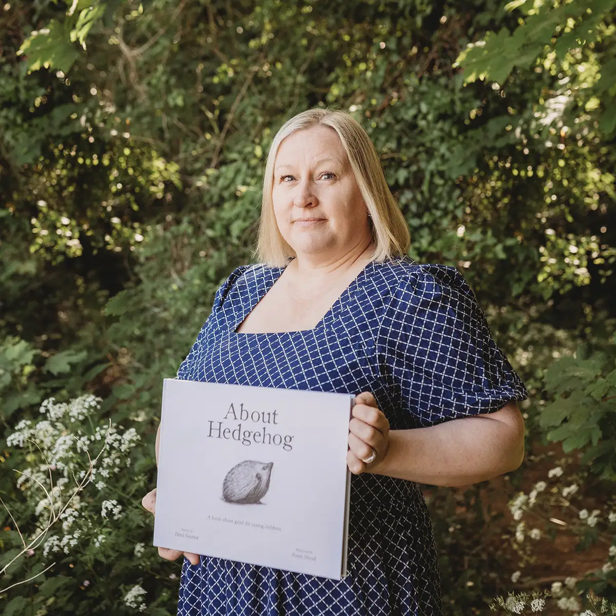 Dani with bereavement book About Hedgehog